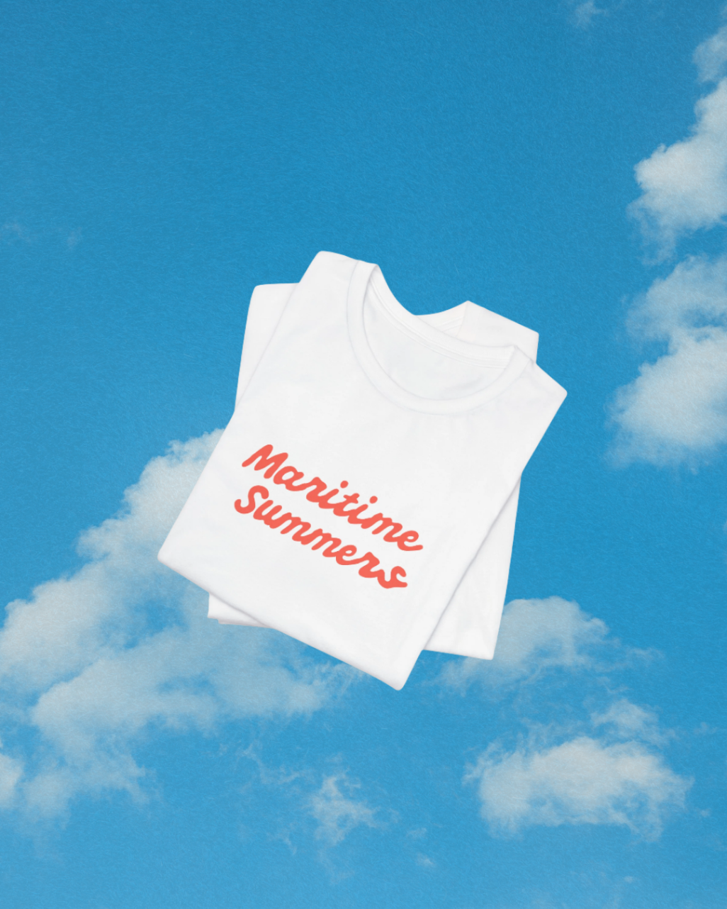 Maritime Summers script tee folded on blue summer sky